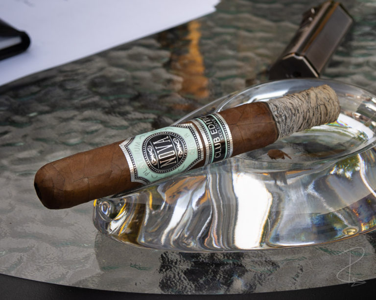 a half smoked Nova Platinum Club Edition Exclusive Toro cigar sat in my ashtray