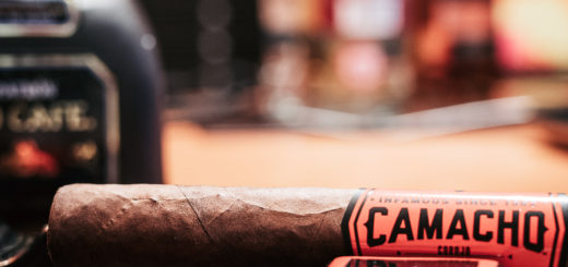 A Camacho Corojo Figurado cigar siting in my ashtray waiting to be lit