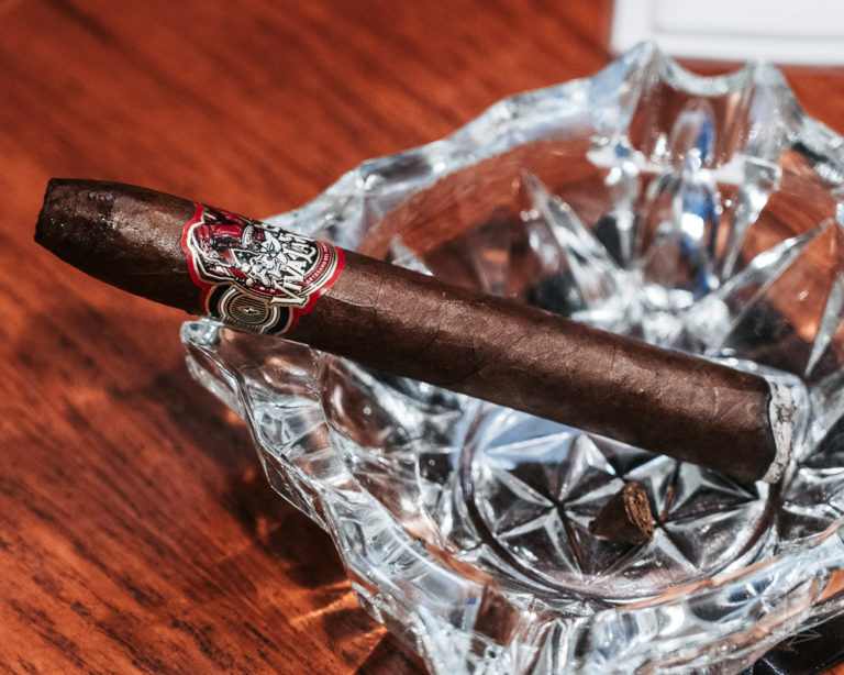 Viva la Vida Torpedo cigar on a crystal glass ashtray