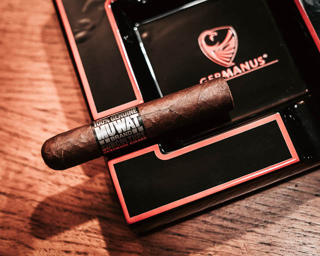 MUWAT Gordo 560 cigar waiting to be lit