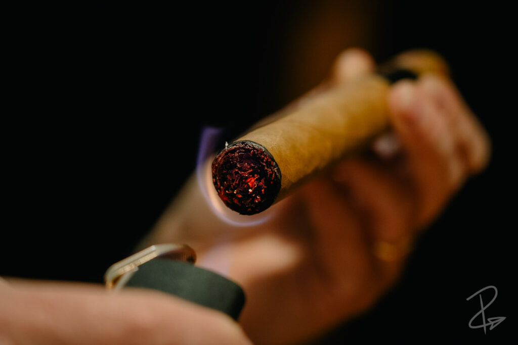 Lighting up the Two Smoking Barrels Toro cigar from GQ Tobaccos